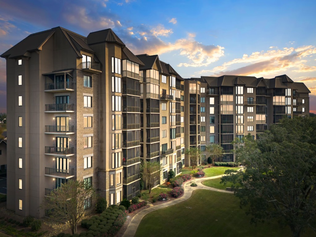 Luxury multi-building condominium community at dusk