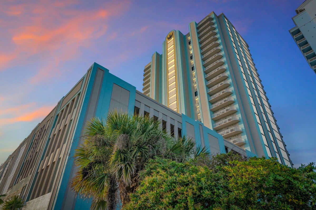 Gulf-front high-rise condos at golden hour